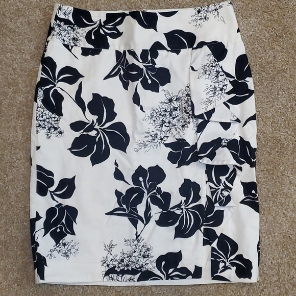 White House Black Market Dresses & Skirts - Floral skirt with ruffled slit